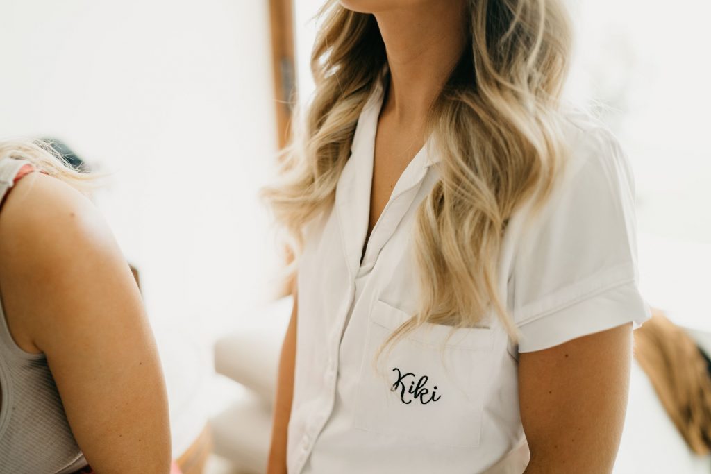 white monogrammed PJs gifted to the bridesmaids