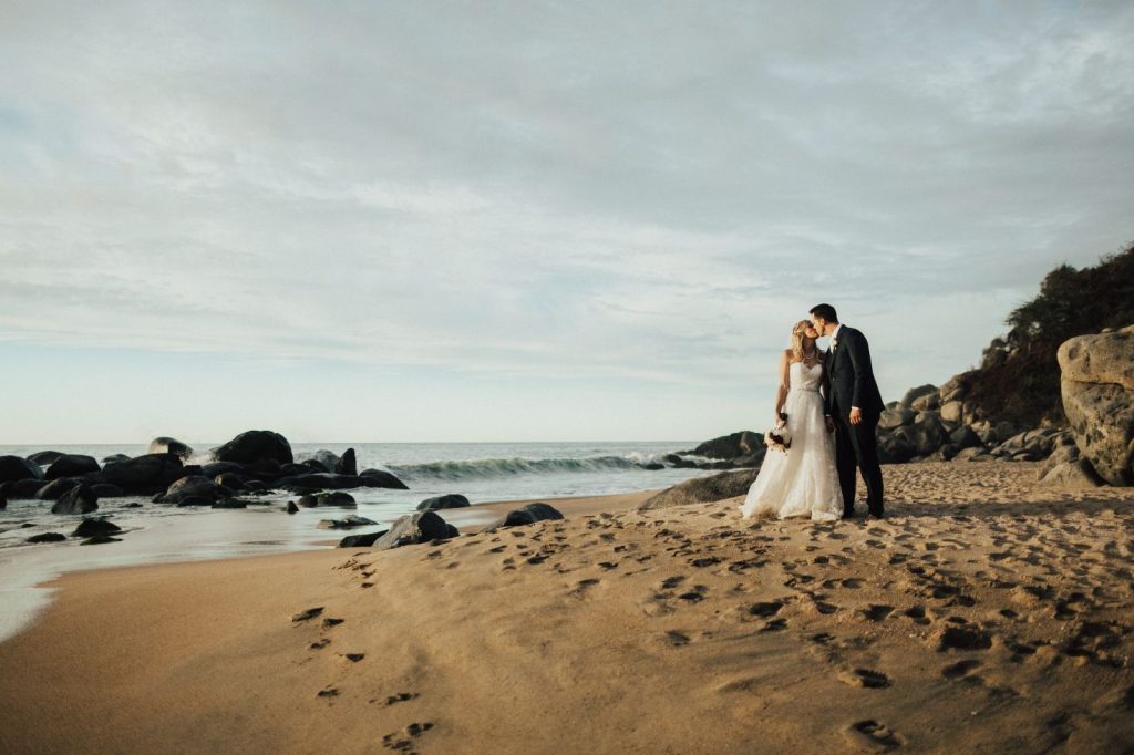 couple stands on beach at private villa wedding in Sayulita Mexico